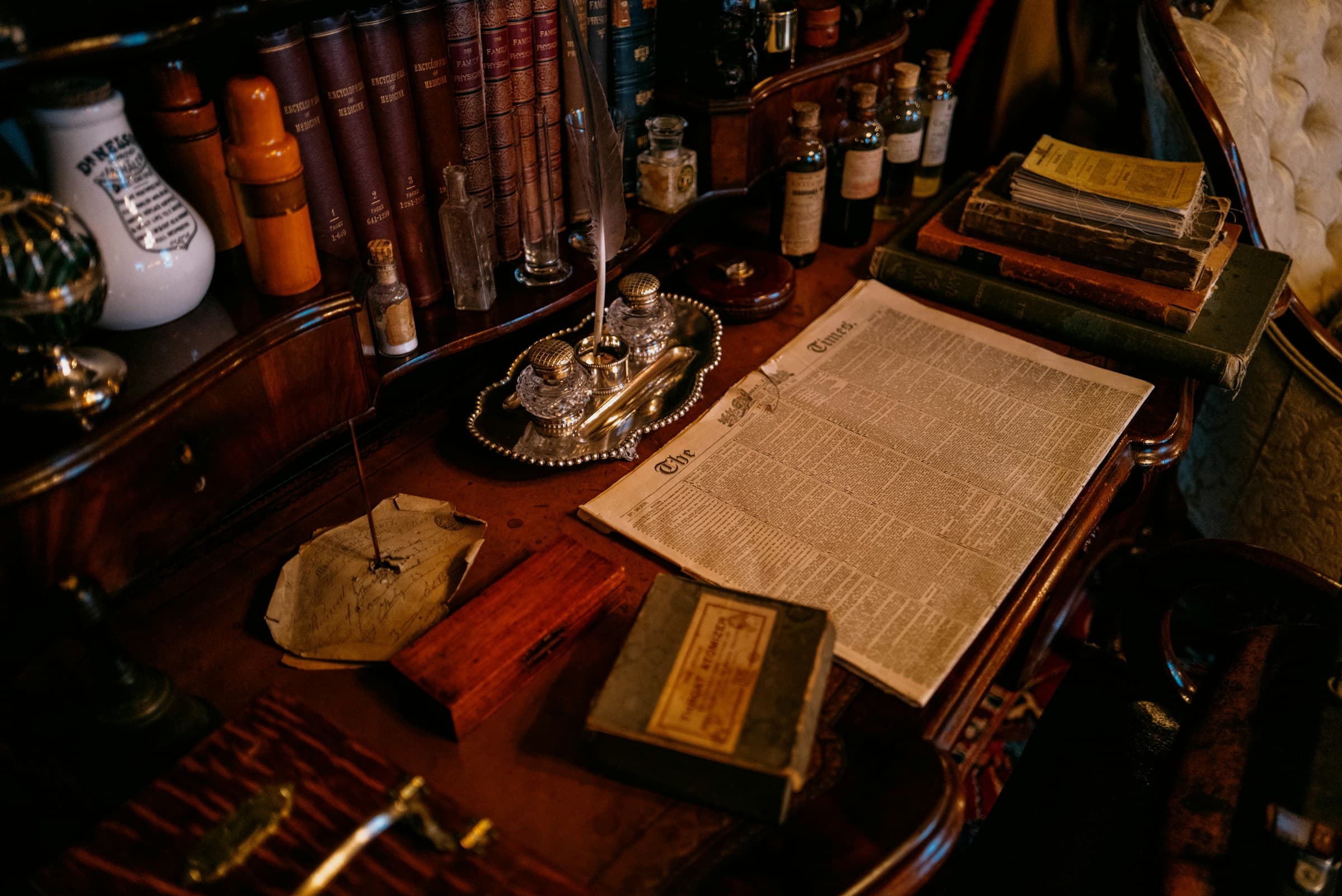 Permits and documents on a wooden desk, soft light, no faces